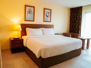Ένα ή περισσότερα κρεβάτια σε δωμάτιο στο Abuja Continental Hotel