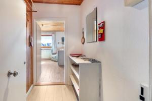 a white kitchen with a counter and a hallway at Haus Am Bühl in Schönau im Schwarzwald
