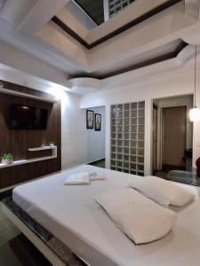 Giường trong phòng chung tại Motel Marajas Mococa - Apartamento 29 +9 ảnh