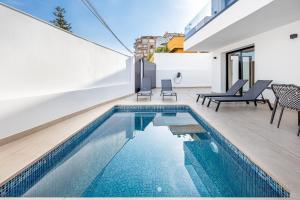 a swimming pool in the backyard of a house at Málaga Benalmádena Vacation Rentals five minutes from the Port of Benalmádena Beach Pool and Sun in Benalmadena Costa