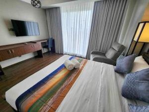 Ένα ή περισσότερα κρεβάτια σε δωμάτιο στο 1 bedroom aeon Tower