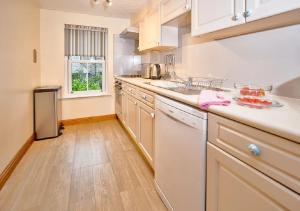 Kuchyň nebo kuchyňský kout v ubytování Apartment 11