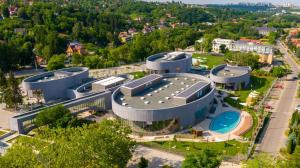 an aerial view of a building in a city at Flóra Panzió in Miskolctapolca
