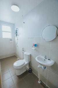 a bathroom with a toilet and a sink at kings Pine Residences Homestay kundasang Ranau 17 in Ranau +56 photos