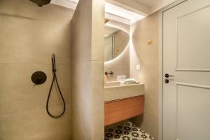 a bathroom with a sink and a shower at Koilada Family House 1 in Koilás +34 photos