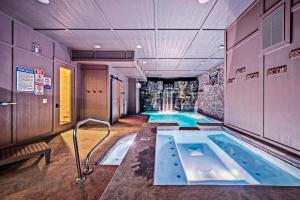 a large indoor swimming pool in a building at Ace In The Hole in Sevierville