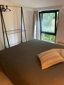 Postel nebo postele na pokoji v ubytování Le petit gîte
