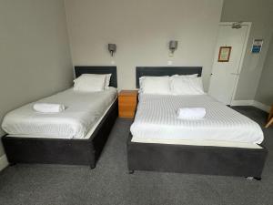 Postel nebo postele na pokoji v ubytování Citi Hotel Aberdeen