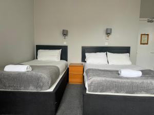 Postel nebo postele na pokoji v ubytování Citi Hotel Aberdeen