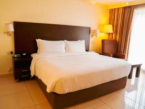 Ένα ή περισσότερα κρεβάτια σε δωμάτιο στο Abuja Continental Hotel