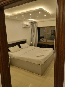 a bedroom with a large bed in a room at 2bedroom aprt at 7th circle f-r1 in Amman