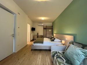 Postel nebo postele na pokoji v ubytování Al Boschetto Rooms