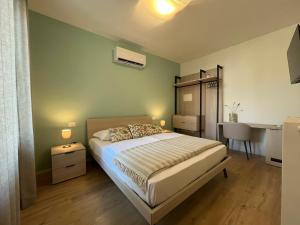 Postel nebo postele na pokoji v ubytování Al Boschetto Rooms
