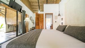 Postel nebo postele na pokoji v ubytování LA QUEBRADA ECO LODGE Hotel Boutique