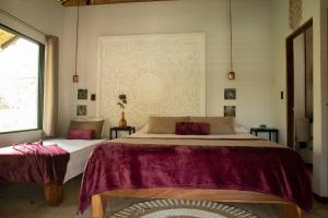 Postel nebo postele na pokoji v ubytování LA QUEBRADA ECO LODGE Hotel Boutique