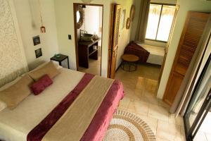 Postel nebo postele na pokoji v ubytování LA QUEBRADA ECO LODGE Hotel Boutique