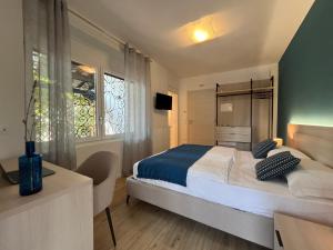 Postel nebo postele na pokoji v ubytování Al Boschetto Rooms