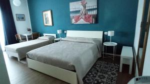 Postel nebo postele na pokoji v ubytování Residenza Capitello 48