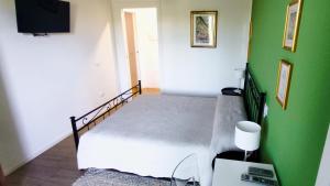 TV a/nebo společenská místnost v ubytování Residenza Capitello 48