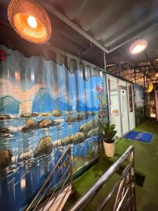 a mural on the wall of a room at Phúc Đạt Container in Vung Tau