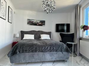 Łóżko lub łóżka w pokoju w obiekcie Apartament Kasprowicza 12A