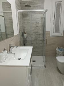 a bathroom with a sink and a shower and a toilet at Stella di Mare - Cà Savio in Cavallino-Treporti +73 photos