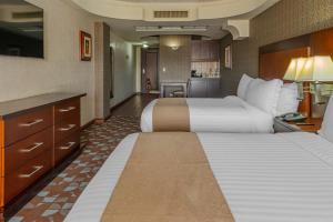 Giường trong phòng chung tại Hotel Plaza San Martin