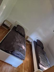 an attic room with two beds in it at Wallaby-1-2-Personen in Brunsbüttel