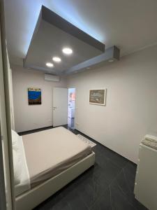 Ένα ή περισσότερα κρεβάτια σε δωμάτιο στο La Casa Vinciana