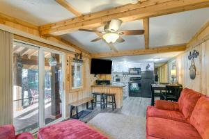 a living room with a couch and a ceiling fan at Island Park Vacation Rental about 31 Mi to Yellowstone in Island Park