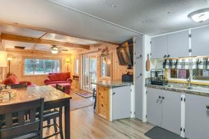 a kitchen and living room in a tiny house at Island Park Vacation Rental about 31 Mi to Yellowstone in Island Park +16 photos