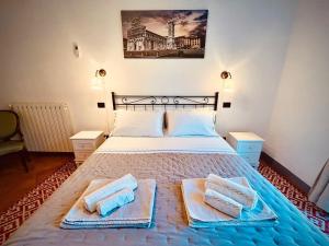 Postel nebo postele na pokoji v ubytování B&B Giardino delle Camelie
