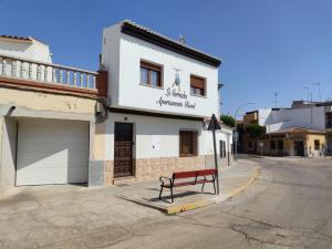 a bench sitting on the side of a street at LA GARRUCHa in Argamasilla de Alba