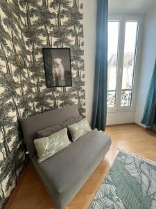 a couch in a living room with a wall at LE BERCHON classé trois épis in Nay