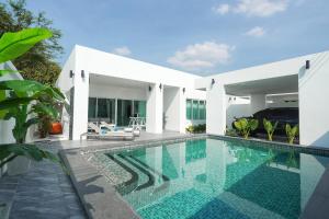 an image of a swimming pool in a villa at First Class Pool Villa Pattaya in Nong Prue