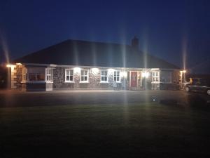 a house at night with lights in a parking lot at Country Haven eircode H54 AK31 in Galway
