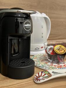 Příslušenství pro přípravu čaje a kávy v ubytování Annalè + 29 fotografií