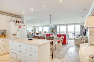 a kitchen and living room with a table and a dining room at Oceanfront Atlantic Beach Condo with View! in Atlantic Beach