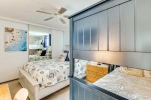 a bedroom with two beds and a ceiling fan at Oceanfront Atlantic Beach Condo with View! in Atlantic Beach +18 photos