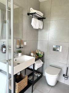a bathroom with a sink and a toilet at 17HILLS Cottage in Acharistsqali +87 photos