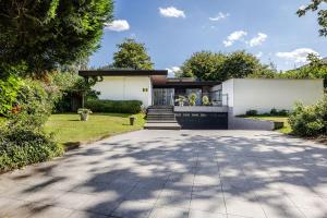 a house with a driveway in front of it at Villa De Keyser in Eeklo