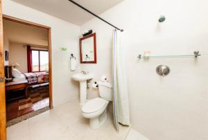 a bathroom with a toilet and a shower at Casa Santalegria in San Juan del Sur +26 photos