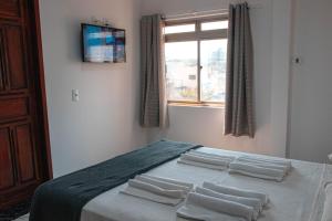 Postel nebo postele na pokoji v ubytování Hotel 15 de Julho + 37 fotografií