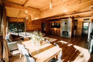 a living room with a table and a couch at Cabana Sia in Sibiu