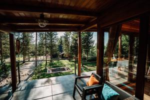 a view from the porch of a house with a view of the forest at Cabana Sia in Sibiu