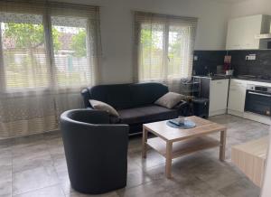 Η κουζίνα ή μικρή κουζίνα στο Appartement meublé +3 φωτογραφίες