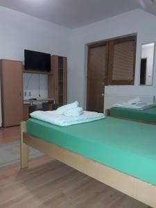 Postel nebo postele na pokoji v ubytování VILA NATALIJA APARTMANI