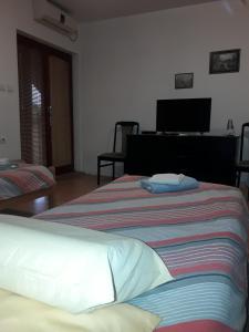 Postel nebo postele na pokoji v ubytování VILA NATALIJA APARTMANI