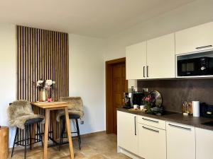 Kuchyň nebo kuchyňský kout v ubytování Apartmán Ranč
