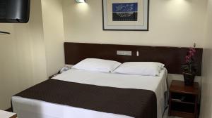 Cama ou camas em um quarto em Cheverny Apart Hotel